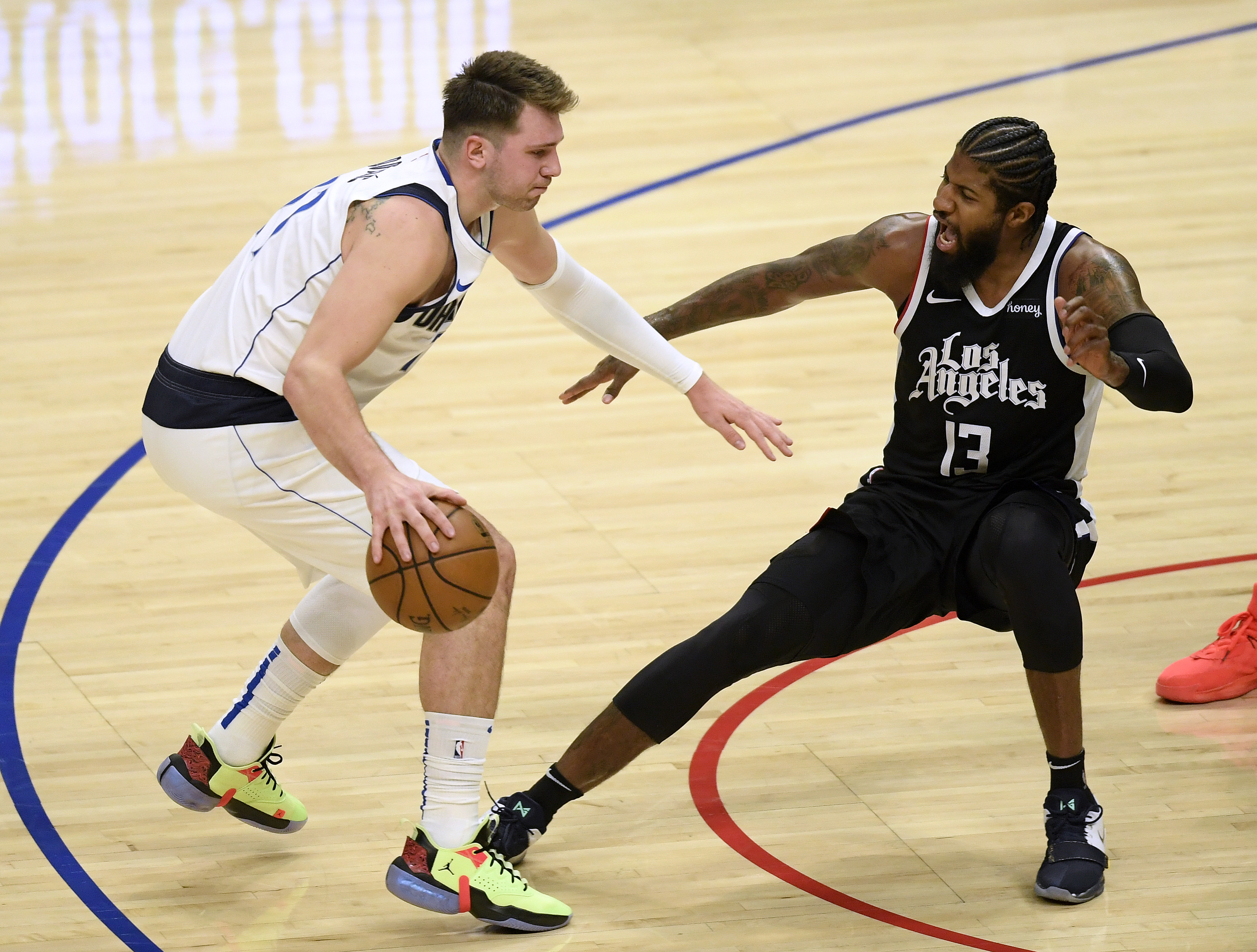 Luka Doncic of the Dallas Mavericks against Paul George of the Los Angles Clippers